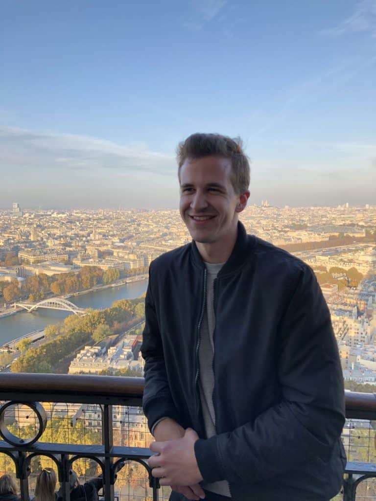 Am American student at the top of the Eiffel tower in Paris, France.