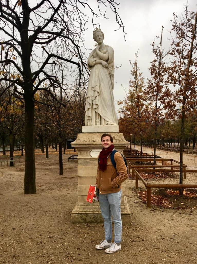 An American student standing in Luxemborg Gardens, Paris.