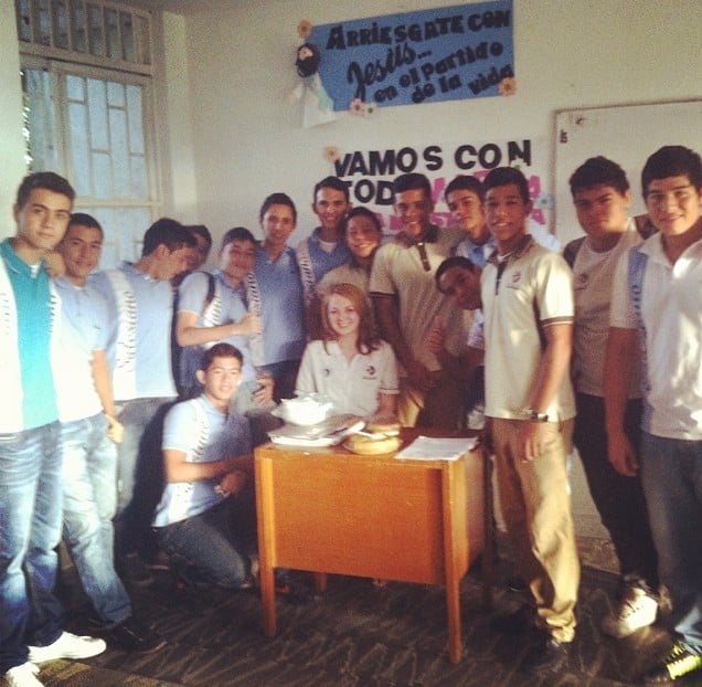 A group of native Colombian school children with their teacher in the classroom.