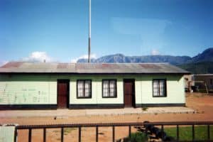 South African house with mountains towering behind.