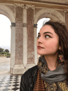 A woman at the Palace of Versailles, France.